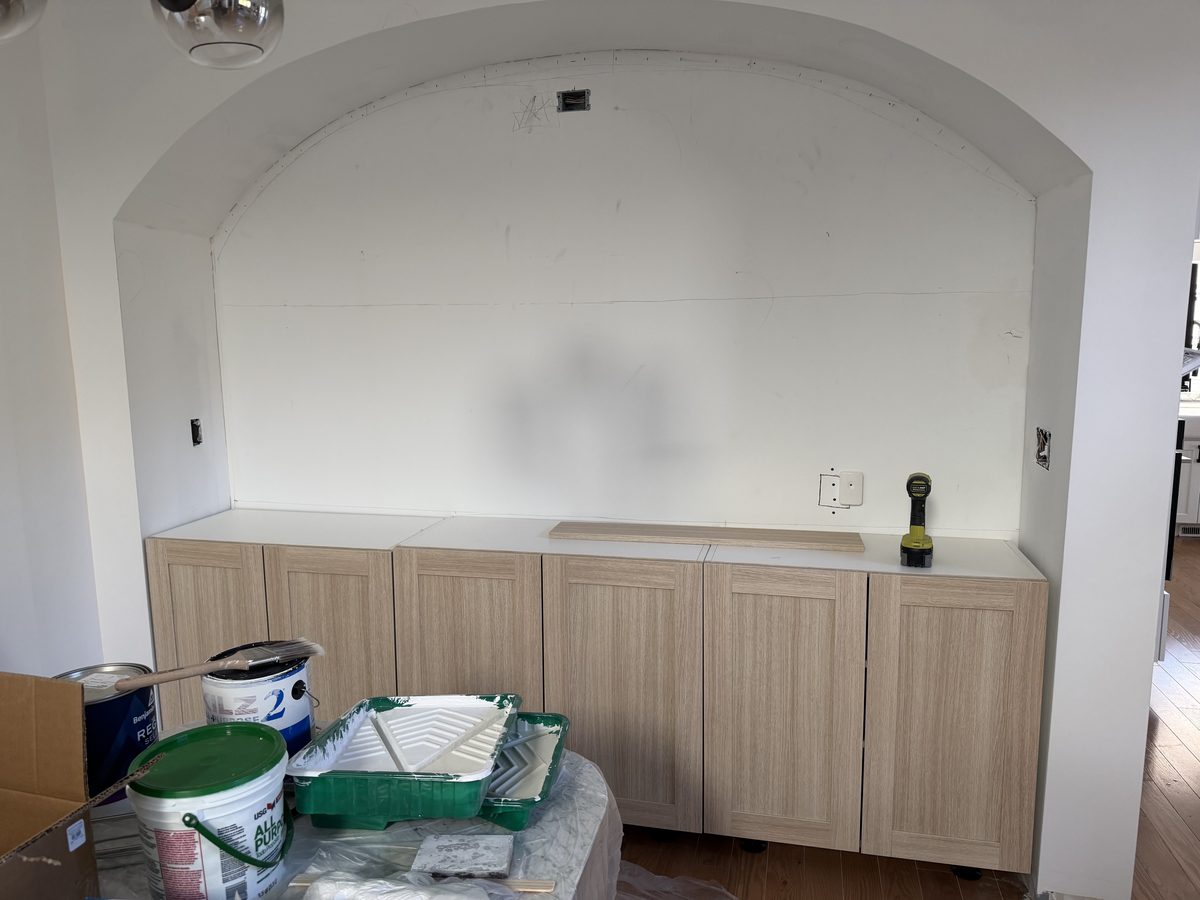 During: cabinets installed, arch drywalled, awaiting finish